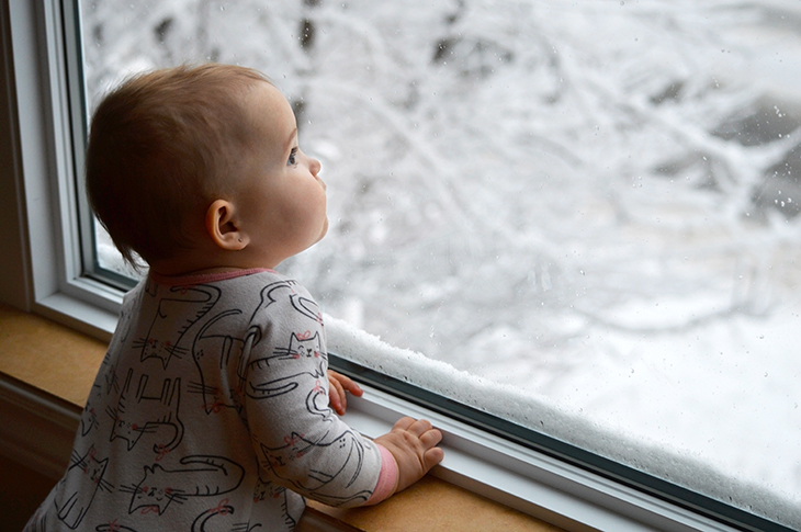 Baby watching snow