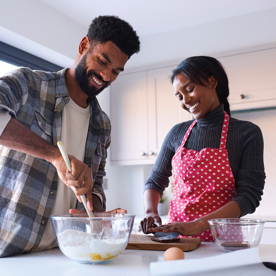 couple at home baking cake together in kitchen 2023 11 27 05 03 59 utc